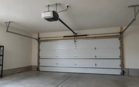 A new belt-drive garage door opener mounted on the garage ceiling